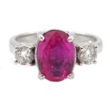 18ct white gold oval pink sapphire and round brilliant cut diamond three stone ring hallmarked,