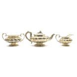 William IV silver teapot and milk jug of lobed circular design,