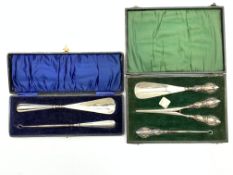 Cased silver handled button hook and shoe horn Birmingham 1913 and a cased set of silver handled