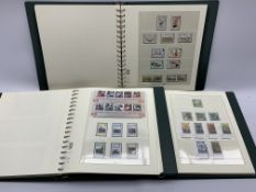 Mint Isle of Man stamps in three albums, including miniature sheets, pairs,