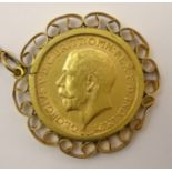 King George V 1915 gold full sovereign, in 9ct gold mount and chain stamped '9ct', total weight 16.