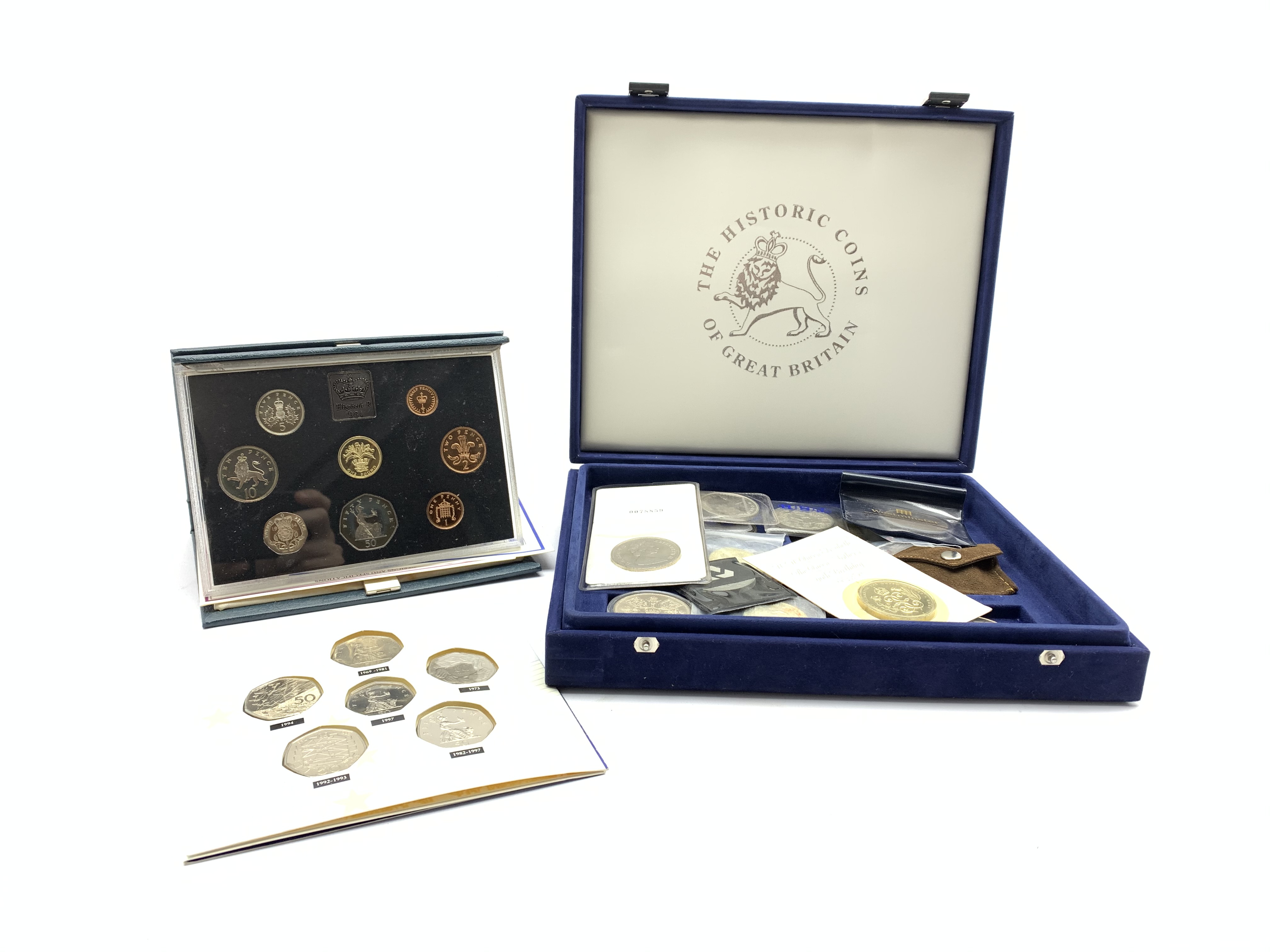 Five five pound coins, United Kingdom 1984 proof coin collection in blue folder, - Image 2 of 2