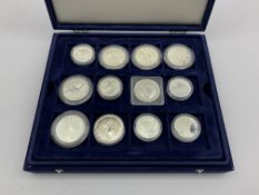 Seven Australian one ounce fine silver coins and eighteen other silver coins of varying sizes all