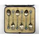 Set of six silver coffee spoons with coloured enamel flower head finials Birmingham 1934,