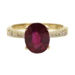 18ct gold oval ruby ring with diamond shoulders,