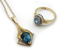 Gold blue topaz and diamond pendant necklace and oval blue topaz and diamond ring,