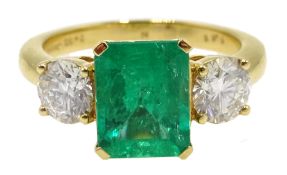 18ct gold emerald and round brilliant cut diamond three stone ring hallmarked, emerald 2.