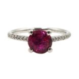 Platinum hot pink round sapphire ring with diamond set shoulders, hallmarked, sapphire approx 1.