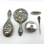 Art Nouveau silver backed hand mirror and matching brush Birmingham 1906, similar nail buffer,