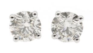 Pair of 18ct white gold round brilliant cut diamond stud earrings, stamped 750,