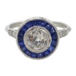 Platinum round old cut diamond and calibre cut sapphire target ring, diamond set shoulders,