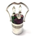 Three Gablonz Bohemian 800 silver mounted coloured glass scent flasks in silver frame with swing