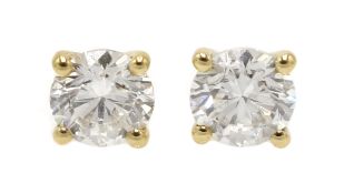 Pair of 18ct gold diamond stud earrings, stamped 750, diamond total weight 0.