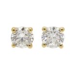 Pair of 18ct gold diamond stud earrings, stamped 750, diamond total weight 0.