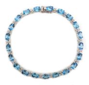 18ct white gold oval blue topaz and diamond bracelet, stamped 750, topaz total weight 12.