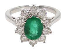 18ct white gold oval emerald and diamond cluster ring, stamped 750, emerald 1.