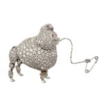 Platinum poodle brooch pave set diamonds, cabochon ruby eyes and calibre cut ruby bow, stamped P.
