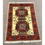 Persian Heriz red ground rug, herati motif on ivory field, stylised trailing foliate to border,