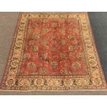 Persian Tabriz ground carpet, with interlaced foliate on red field, double guarded ivory border,