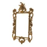 20th century gilt framed wall mirror with scrolled floral frame,