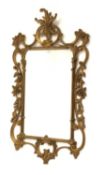 20th century gilt framed wall mirror with scrolled floral frame,