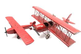 Ceiling hanging red painted model of a biplane,