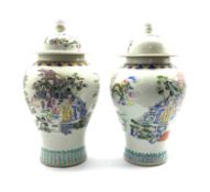 Near pair 20th Century Chinese Baluster vases and covers,