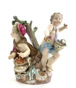 Meissen group of two cherubs depicting two of the Seasons, one with a brazier,