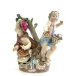 Meissen group of two cherubs depicting two of the Seasons, one with a brazier,