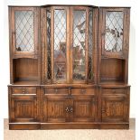 20th century Tudor design oak sectional display cabinet, led glazed doors enclosing shelves,