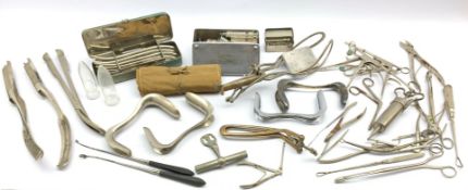 Collection of obstetrician's and other surgeons instruments including forceps, syringes,
