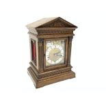 Late 19th century mantel clock in a Palladian oak case,