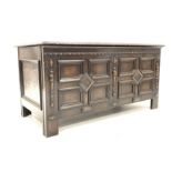 Jacobean design oak coffer, with geometric panelled front and sides, split turned pilasters,