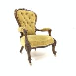 Victorian mahogany open armchair, with leaf carved cresting rail, swept and scrolled arms,