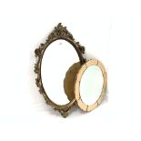 Circular wall mirror with rose tinted glass surrounding bevelled plate,