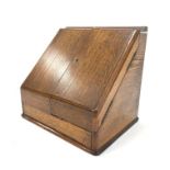 Edwardian oak stationery casket with divided doors,