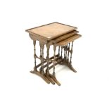 Reprodux walnut nest of three tables, each with raised top,