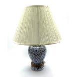 20th Century blue and white ceramic lamp with floral decoration and shade,