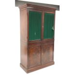 * Regency mahogany clothes press with ebonised stringing and moulded cornice above a pair of