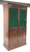 * Regency mahogany clothes press with ebonised stringing and moulded cornice above a pair of