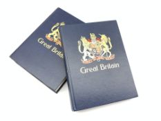 Two large stamp albums containing used Great British stamps, including pre-decimal, higher values,