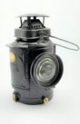 Railway type lamp, black painted with metal plaque reading 'LMS RAILWAY',
