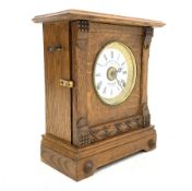 Early 20th century automatic alarm oak cased mantel clock,