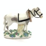 18th Century Meissen figure of a standing horse with a yoke and reins,