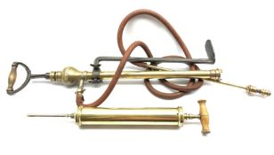 Crescent brass stirrup pump with cast iron bracket, and brass vets pump,