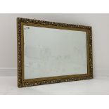 Gilt framed rectangular wall mirror with floral and bead moulded frame,