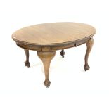 Early 20th century Georgian style mahogany oval extending dining table with two leaves,