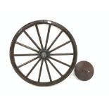 19th century wooden and iron bound cartwheel, with wall fixture,