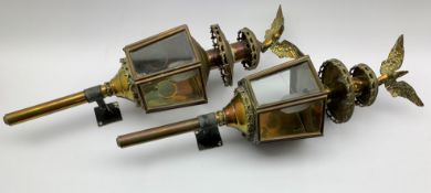 Pair brass carriage lanterns, four inset glass panels, eagle finials to the top of both,