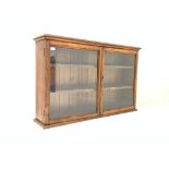 19th century oak wall mounted cabinet with two glazed doors enclosing two adjustable shelves,